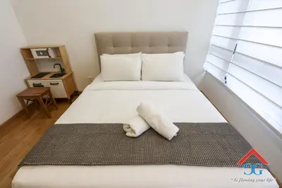 a room with a bed with a towel on it at ASTORIA AMPANG in Kuala Lumpur