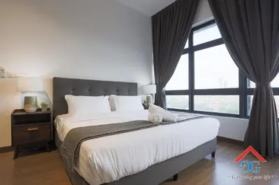 a bedroom with a large bed with a large window at ASTORIA AMPANG in Kuala Lumpur