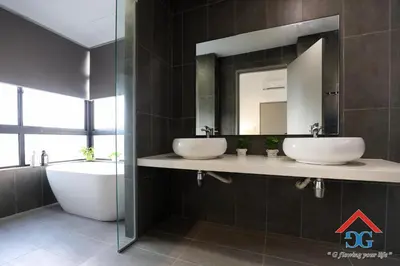 a bathroom with two sinks and a tub and a mirror at ASTORIA AMPANG in Kuala Lumpur