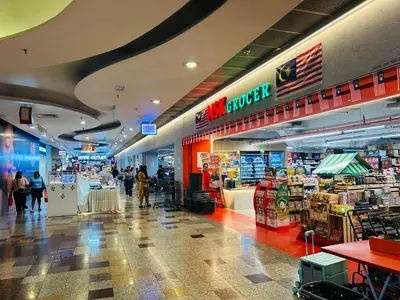 a store with people walking through a shopping mall at KSM GLOBAL APARTMENT At TIMES SQUARE kl in Kuala Lumpur