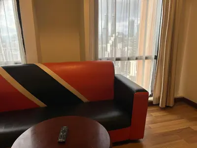 a living room with a couch and a table at KSM GLOBAL APARTMENT At TIMES SQUARE kl in Kuala Lumpur