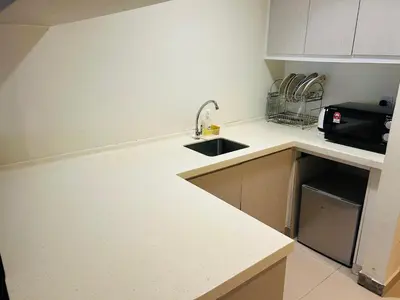 a kitchen with a sink and a counter top at KSM GLOBAL APARTMENT At TIMES SQUARE kl in Kuala Lumpur