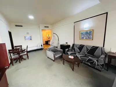 a living room with a couch and a table at KSM GLOBAL APARTMENT At TIMES SQUARE kl in Kuala Lumpur