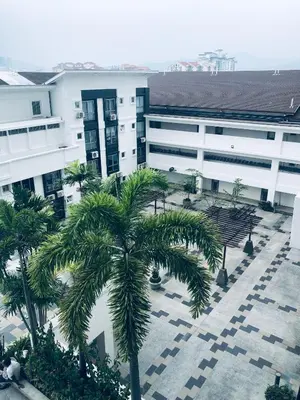 a palm tree in front of a building at Duplex Axis Condo @Ampang nearby KLCC. in Ampang