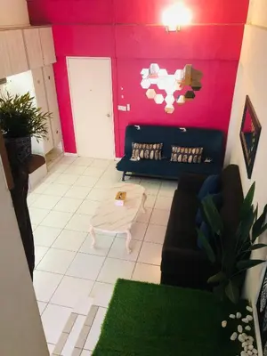a living room with a couch and a table at Duplex Axis Condo @Ampang nearby KLCC. in Ampang