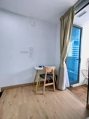 a room with a table and a chair and a window at The Colony KLCC view by NZV in Kuala Lumpur