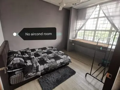 a bedroom with a bed with a no ethanol room sign at Blue house KL Homestay in Kuala Lumpur