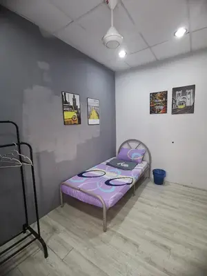 a small bed in a room with a purple mattress at Blue house KL Homestay in Kuala Lumpur