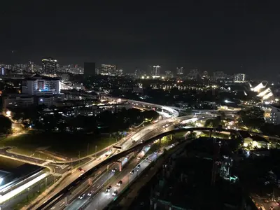 a city at night with traffic on a freeway at TR Residence 3R2B Serviced Apt 5-6pax HKL,IJN,PWTC KL in Kuala Lumpur