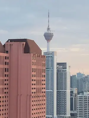 a view of a city with the space needle at TR Residence 3R2B Serviced Apt 5-6pax HKL,IJN,PWTC KL in Kuala Lumpur
