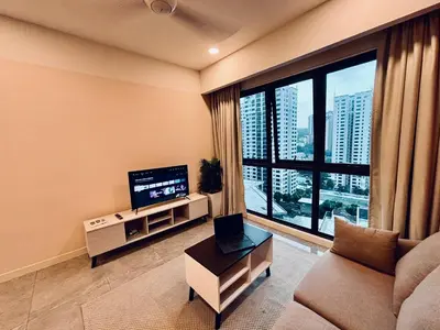 a living room with a couch and a large window at The Ooak Suites by Bamboo Hospitality in Kuala Lumpur