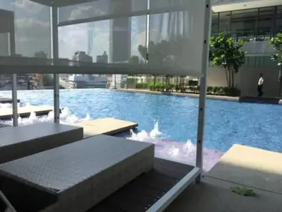 a large swimming pool in the middle of a building at Meta @ Robertson KL Bukit Bintang in Kuala Lumpur