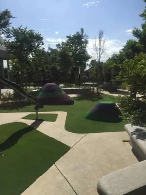 a garden with green grass and two golf balls at Meta @ Robertson KL Bukit Bintang in Kuala Lumpur