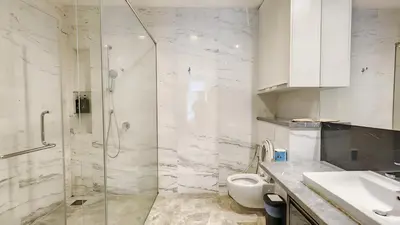 a bathroom with a shower and a toilet and a sink at The Platinum KLCC in Kuala Lumpur