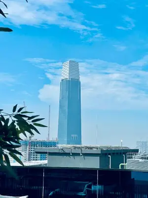 a tall skyscraper in the middle of a city at EatonResidences KLCC by MAH in Kuala Lumpur