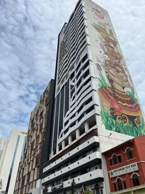 a tall building with a mural on the side of it at #173 M101 Dang Wangi KLCC View Pool By Livin in Kuala Lumpur