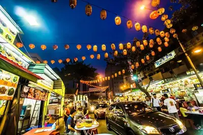 a busy city street at night with people and cars at Stylish & Cozy TTDI Ascencia Studio FREE Parking in Kuala Lumpur