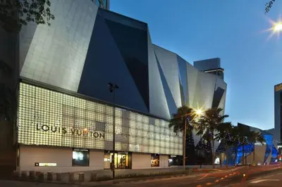a building with a sign on the side of it at Stylish & Cozy TTDI Ascencia Studio FREE Parking in Kuala Lumpur