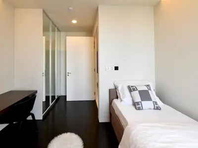 a bedroom with a bed and a desk and a mirror at Tropicana The Residences - KLCC VIEW Luxury Apartment Collections in Kuala Lumpur