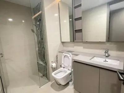 a bathroom with a toilet and a sink and a shower at Eaton Residences in Kuala Lumpur