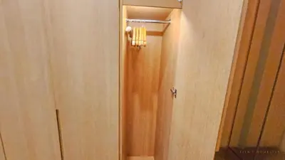 a hallway with a door with a light on it at Luxurious stay in 188 Fraser Residence Suite in Kuala Lumpur