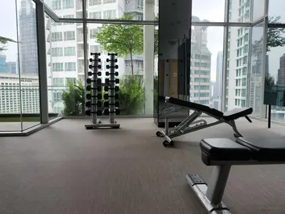 a gym with cardio equipment in a large building at Luxurious stay in 188 Fraser Residence Suite in Kuala Lumpur