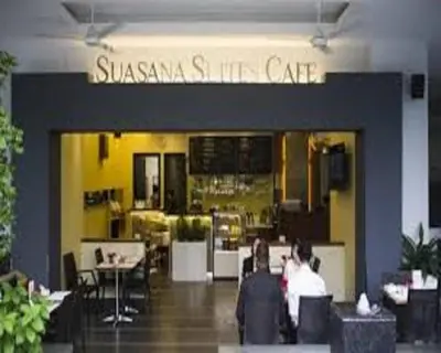 a restaurant with people sitting in front of it at Suasana Suites KLCC by Grand Royal in Kuala Lumpur