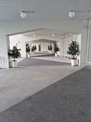 an empty hallway with potted plants in a building at Una Residence by Maya in Kuala Lumpur
