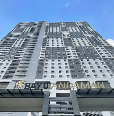 a tall building with a sign on the side of it at Bayu Andaman KL Centre in Kuala Lumpur