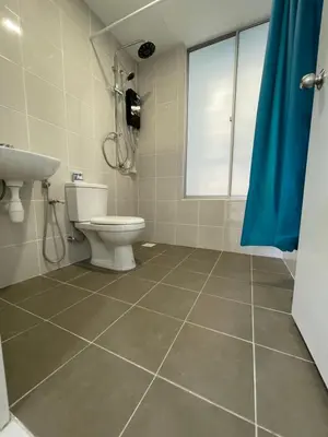 a bathroom with a toilet and a sink at Bayu Andaman KL Centre in Kuala Lumpur