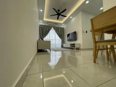 a living room with a ceiling fan and a television at Bayu Andaman KL Centre in Kuala Lumpur