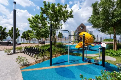 a playground with a slide in a park at M Vertica Premier Suites Kuala Lumpur in Kuala Lumpur