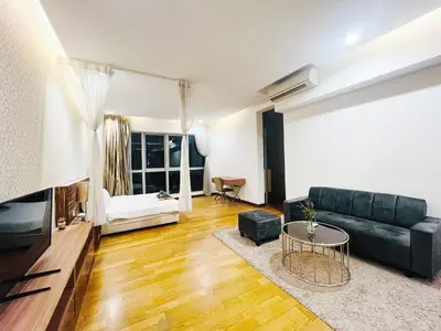 a living room with a couch and a table at Awesomestay Apartment walk to PWTC near to KLCC in Kuala Lumpur