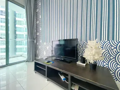 a living room with a television on a table at Awesomestay Apartment walk to PWTC near to KLCC in Kuala Lumpur