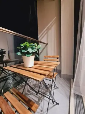 a wooden table with a potted plant on top of it at Lavile A-Z Property Management Service @ welcome pm for more info in Kuala Lumpur