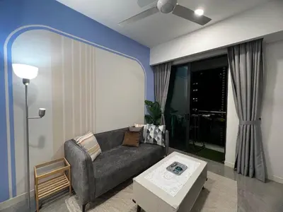 a living room with a couch and a table at The Ooak Suite in Kuala Lumpur