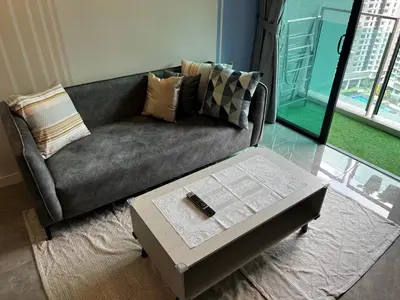 a living room with a couch and a coffee table at The Ooak Suite in Kuala Lumpur