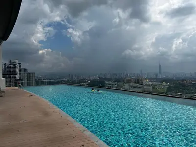 a large swimming pool on top of a building at The Ooak Suite in Kuala Lumpur