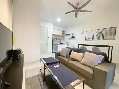 a living room with a couch and a ceiling fan at Arte Mont Kiara By Awesomestay in Kuala Lumpur