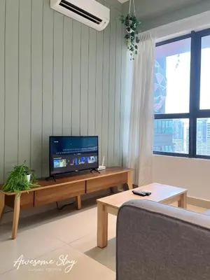 a living room with a television and a couch at Arte Plus Ampang By Awesomestay in Kuala Lumpur