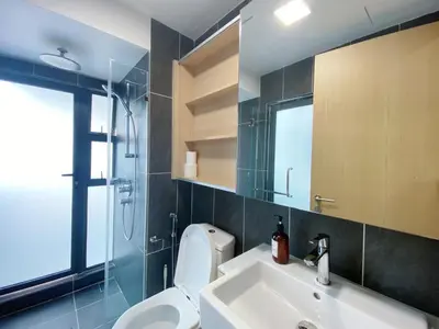 a bathroom with a toilet and a sink and a shower at The Colony By Infinitum By Awesomestay in Kuala Lumpur