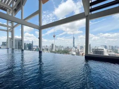 a infinity pool with a view of the city at The Colony By Infinitum By Awesomestay in Kuala Lumpur