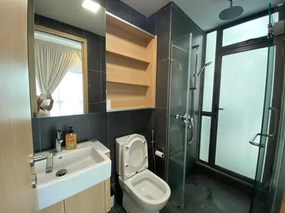 a bathroom with a toilet and a sink and a shower at The Colony By Infinitum By Awesomestay in Kuala Lumpur