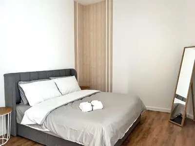 a bedroom with a bed with two towels on it at Quill Residences Kuala Lumpur in Kuala Lumpur