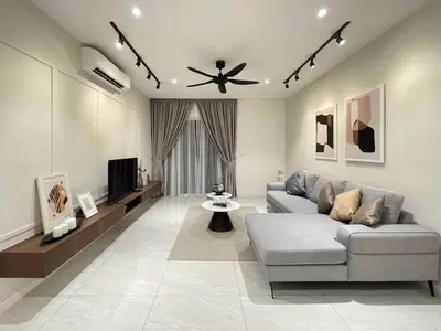 a living room with a couch and a tv at Quill Residences Kuala Lumpur in Kuala Lumpur
