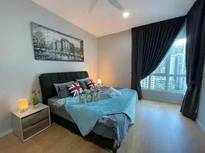 a bedroom with a bed with a blue blanket at Inspirasi Mont Kiara 3 Rooms Balcony Free WIFI & Carpark By The Homez in Kuala Lumpur