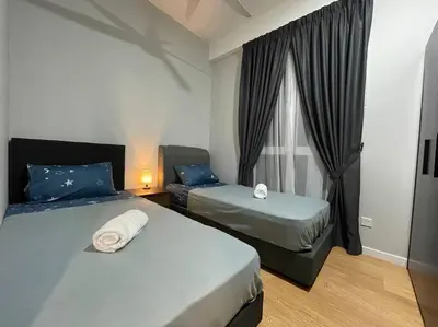 a bedroom with two beds and a window at Inspirasi Mont Kiara 3 Rooms Balcony Free WIFI & Carpark By The Homez in Kuala Lumpur