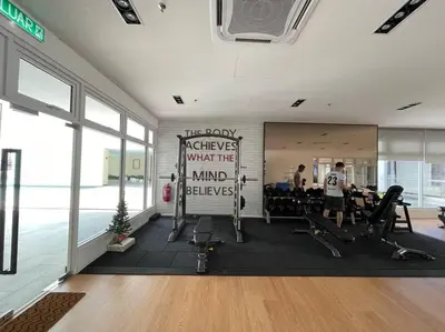 a gym with a sign that says giveaways what the mind believes at Inspirasi Mont Kiara 3 Rooms Balcony Free WIFI & Carpark By The Homez in Kuala Lumpur