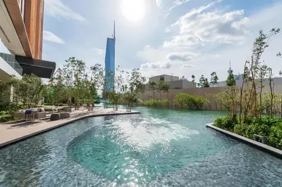 a swimming pool in a city with a skyscraper at Lucentia Residence Bukit Bintang in Kuala Lumpur