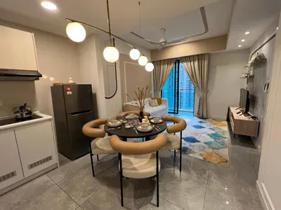 a kitchen and dining room with a table and chairs at OOAK residence in Kuala Lumpur